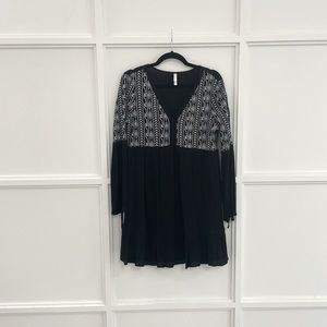 Black long sleeve dress with white detailing